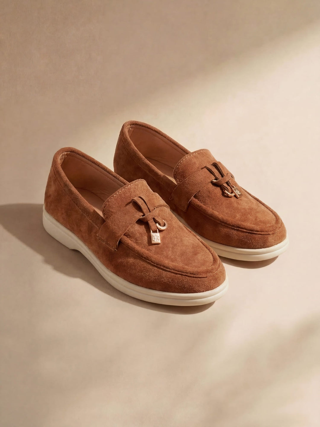 Women's flat slip-on loafers with rounded moc toe and metal trim