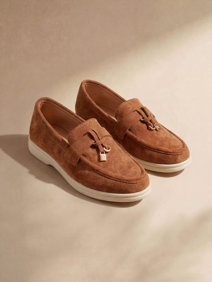 Women's flat slip-on loafers with rounded moc toe and metal trim