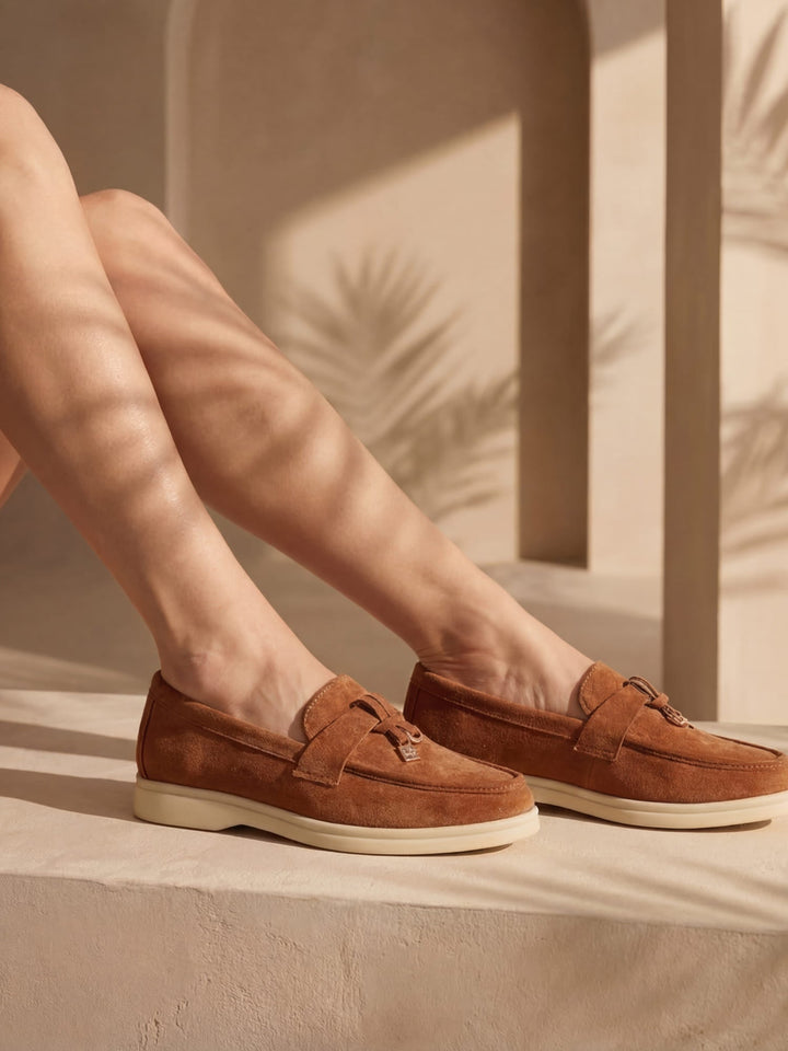 Women's flat slip-on loafers with rounded moc toe and metal trim