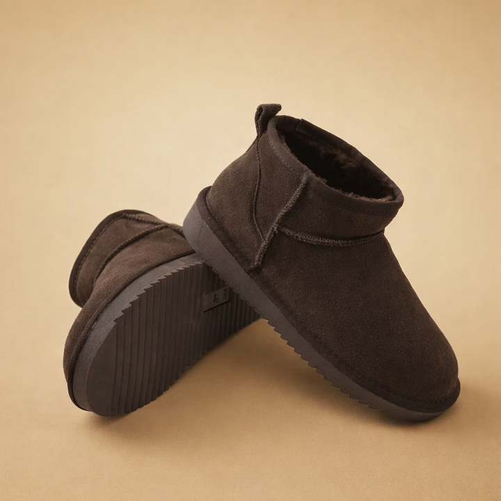 Women's ultra mini boots with fur-style lining and pull tabs
