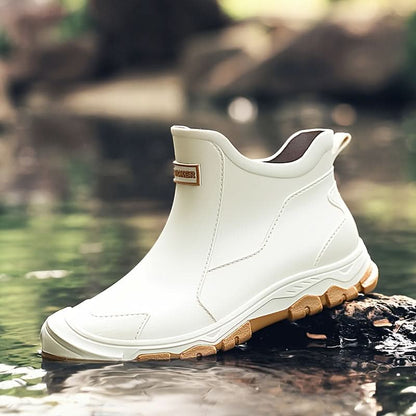 Ankle boots with pull tabs, stitched panels and lug soles
