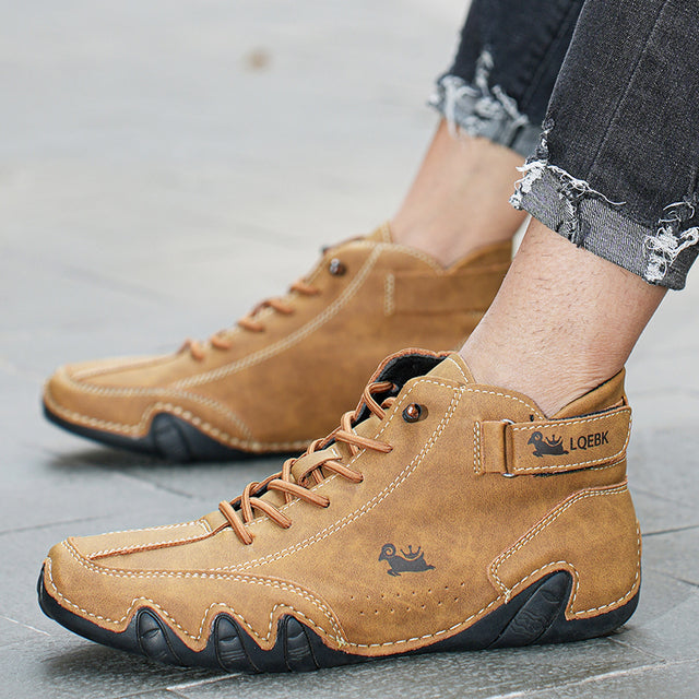 High-top lace-up ankle boots with ankle strap and textured flat sole