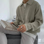 Men's quarter zip rib knit sweater with collared neckline and long sleeves
