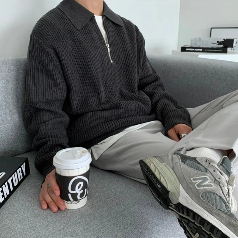 Men's quarter zip rib knit sweater with collared neckline and long sleeves