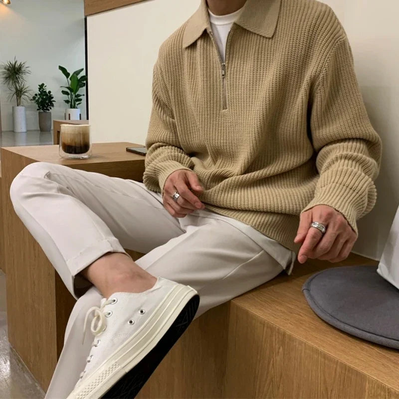 Men's quarter zip rib knit sweater with collared neckline and long sleeves
