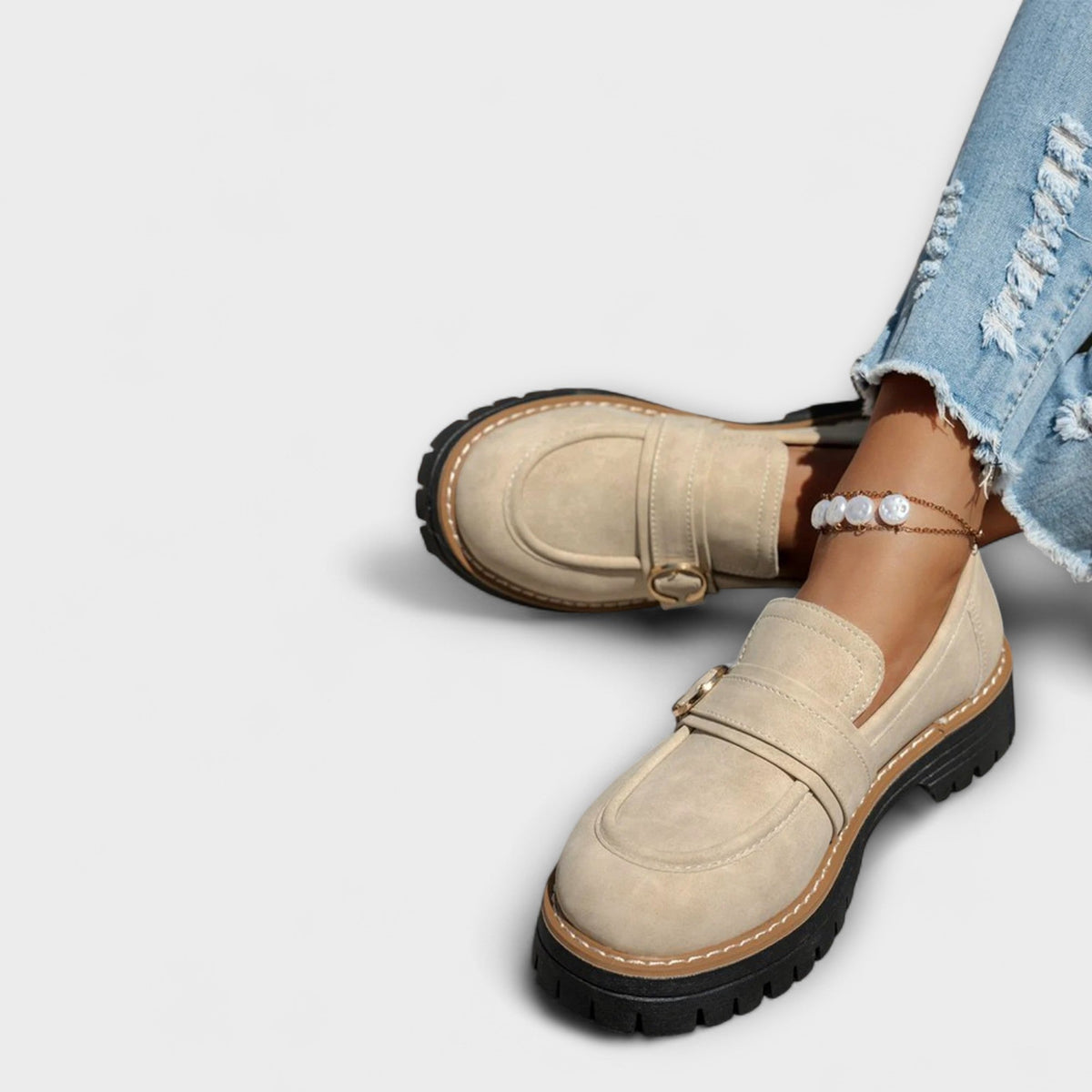 Women's round-toe loafers with metal ring trim and chunky lug soles