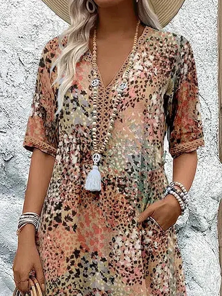 Women's abstract print midi dress with V-neck and three-quarter sleeves, shown in mixed-tone colourway