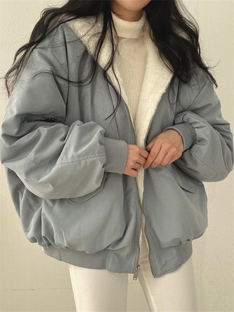 Women's reversible hooded bomber jacket with zip front and ribbed trims