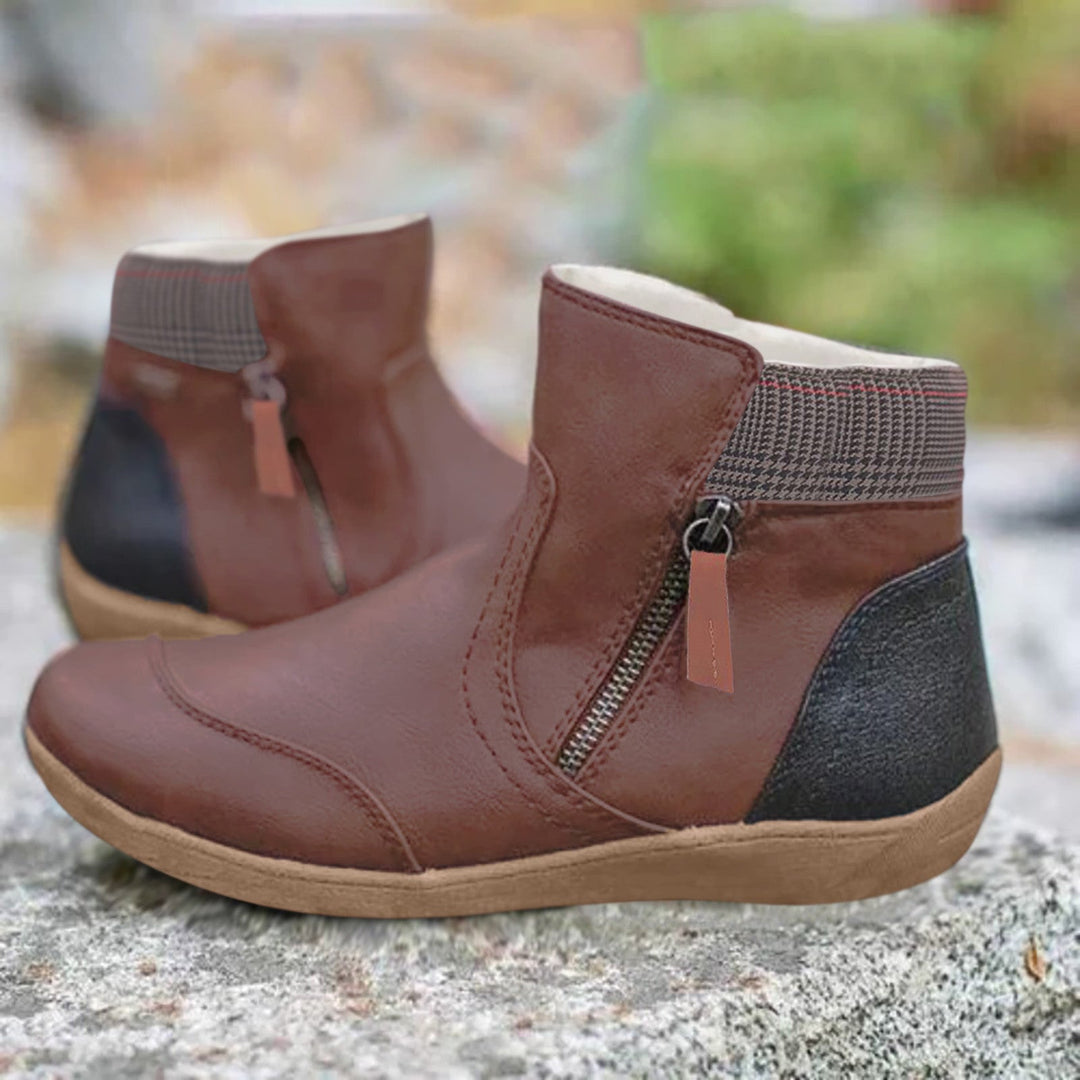 Women's zip ankle boots with round toe, checked collar and flat tan sole