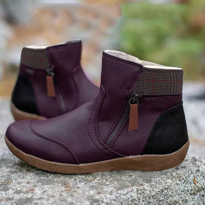 Women's zip ankle boots with round toe, checked collar and flat tan sole
