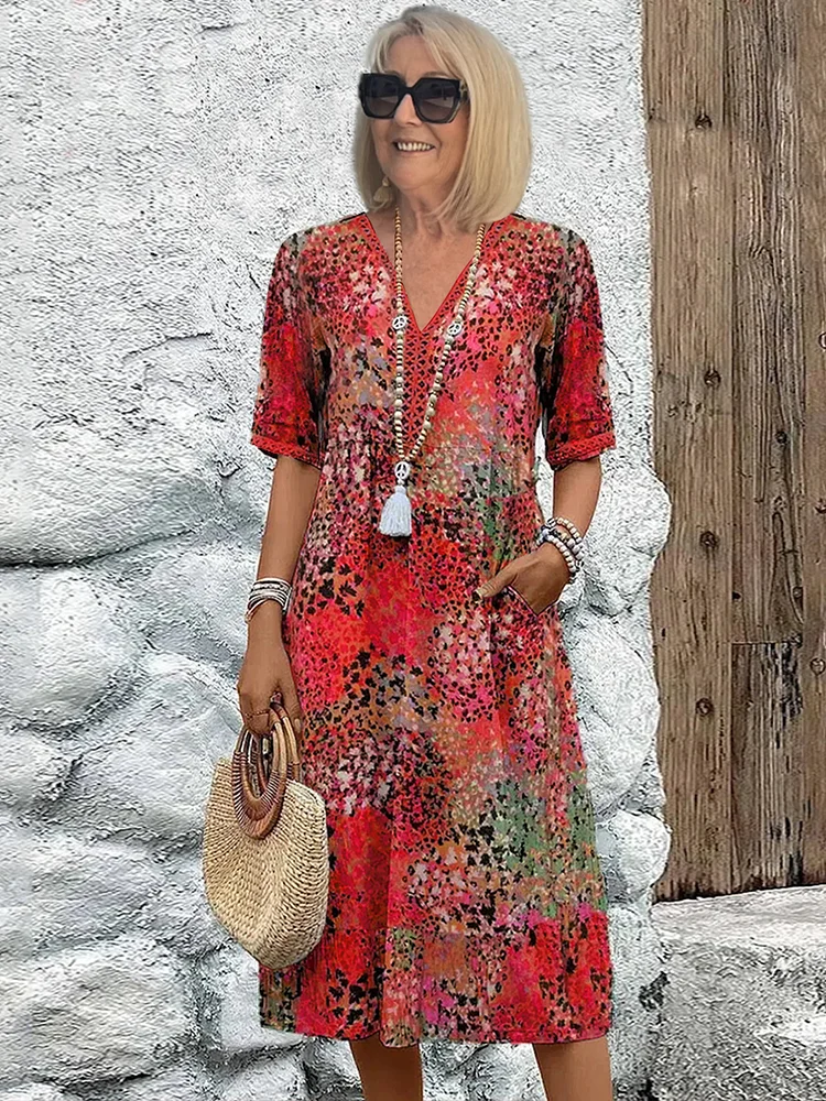 Women's abstract print midi dress with V-neck and three-quarter sleeves, shown in mixed-tone colourway