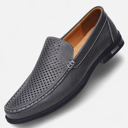 Men's perforated slip-on loafer with stitched trim and flat sole