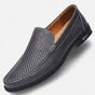 Men's perforated slip-on loafer with stitched trim and flat sole