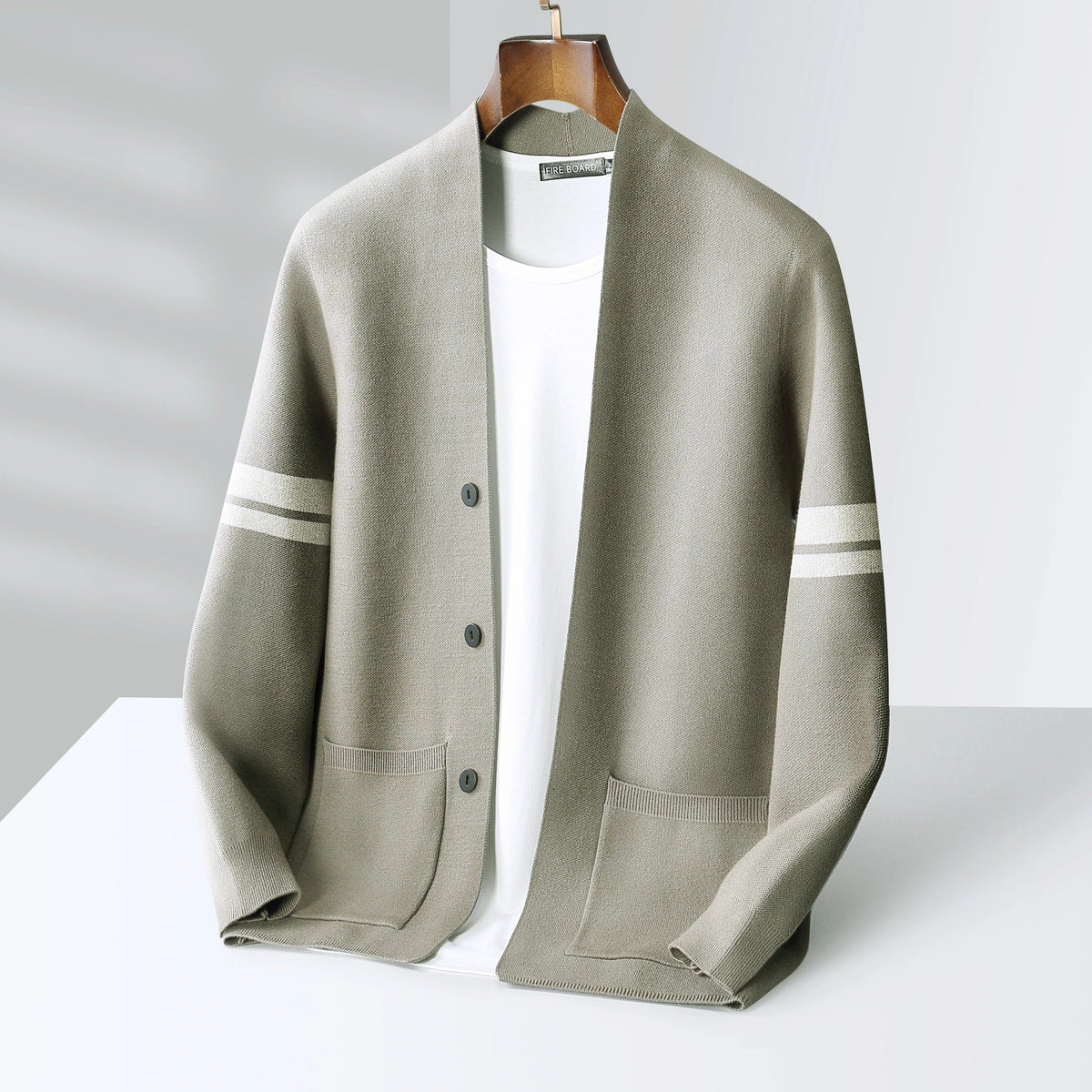 Men's button-front cardigan with striped sleeves and patch pockets