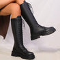 Black women's knee high lace-up platform boots with chunky lug soles