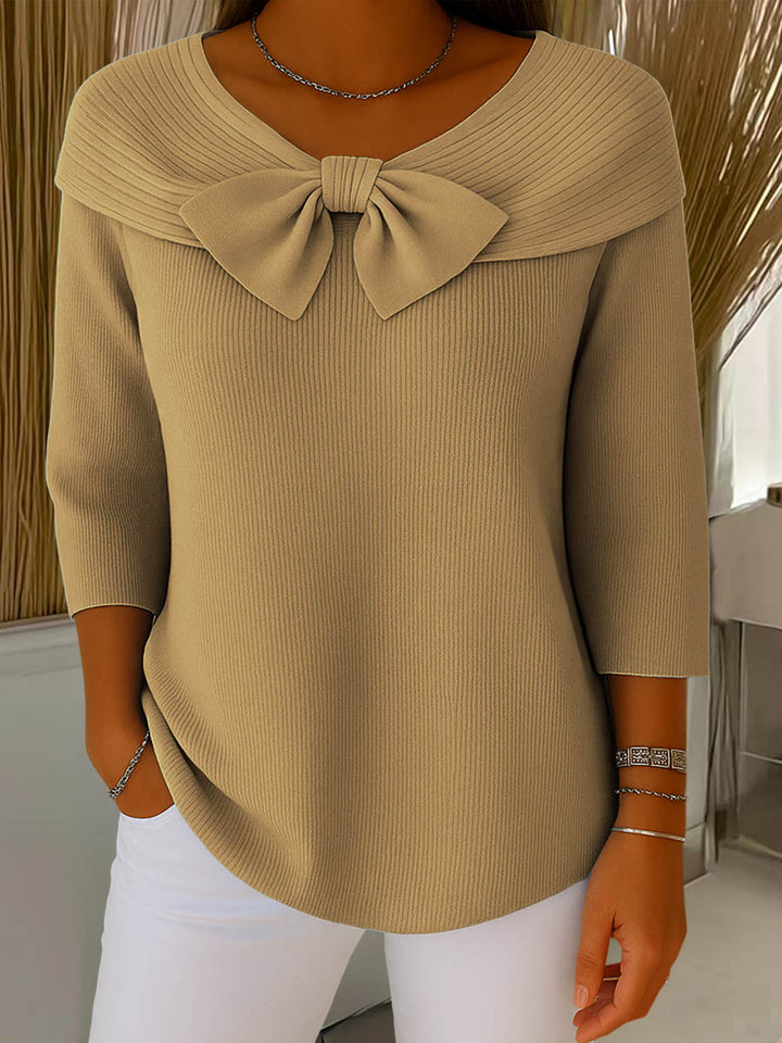 Women's ribbed sweater top with boat neckline and front bow