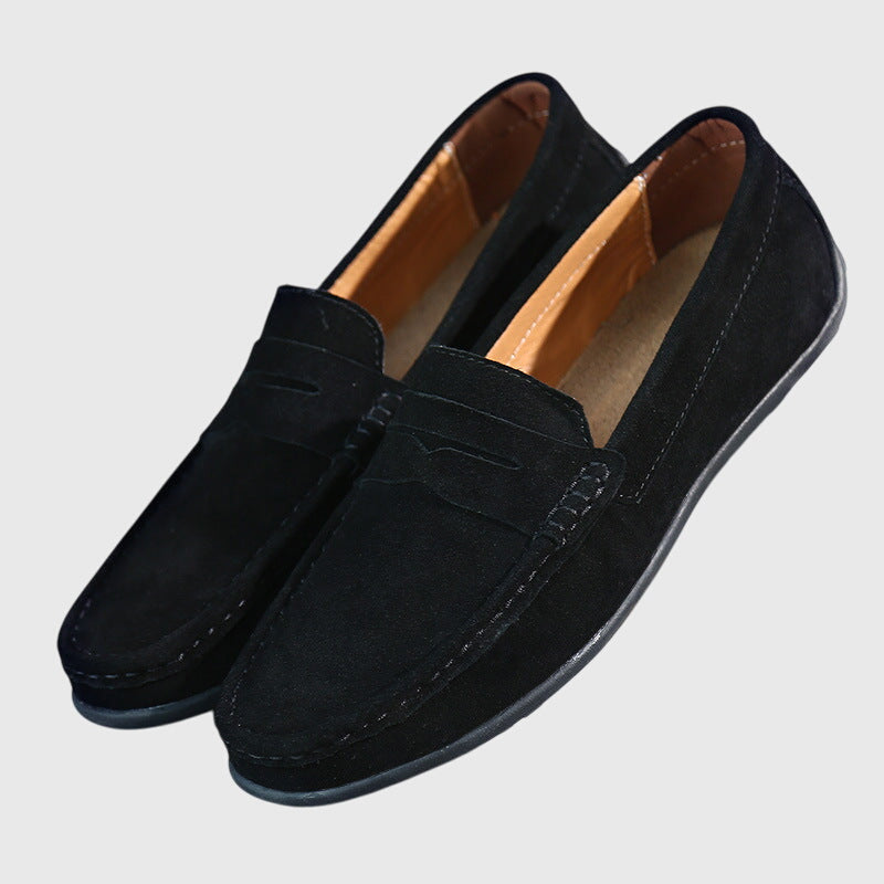 Classic slip-on loafers with penny strap and moc-toe stitching