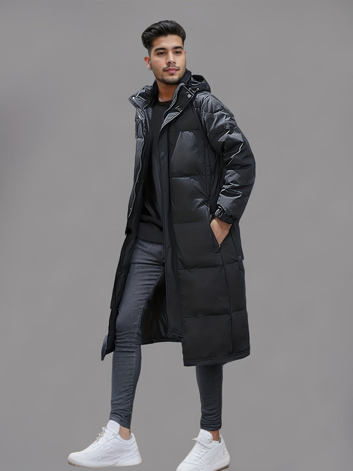 Men's black long hooded puffer coat with quilted panels and zip front