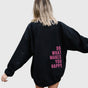 Women's oversized hooded sweatshirt with long sleeves and bold back text