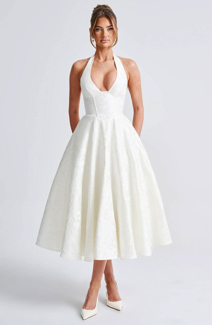 Women's halter midi dress with V-neckline and full A-line skirt in white and pale yellow