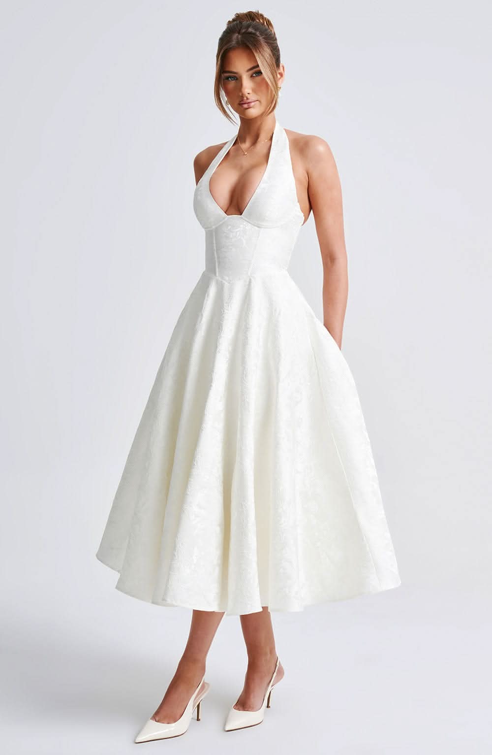 Women's halter midi dress with V-neckline and full A-line skirt in white and pale yellow