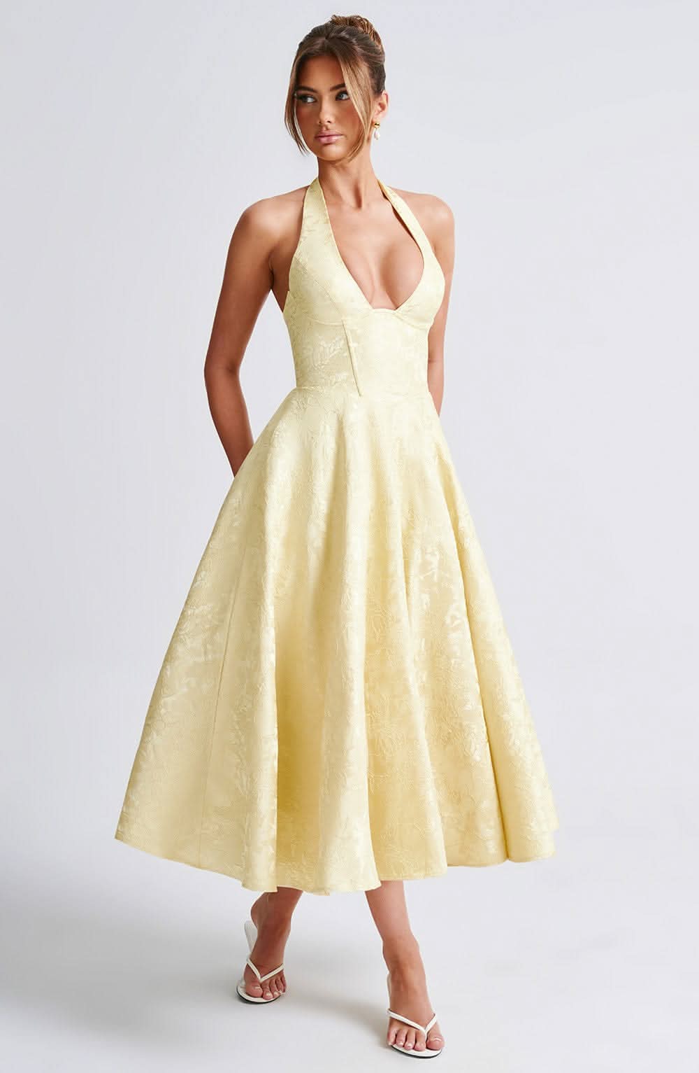 Women's halter midi dress with V-neckline and full A-line skirt in white and pale yellow