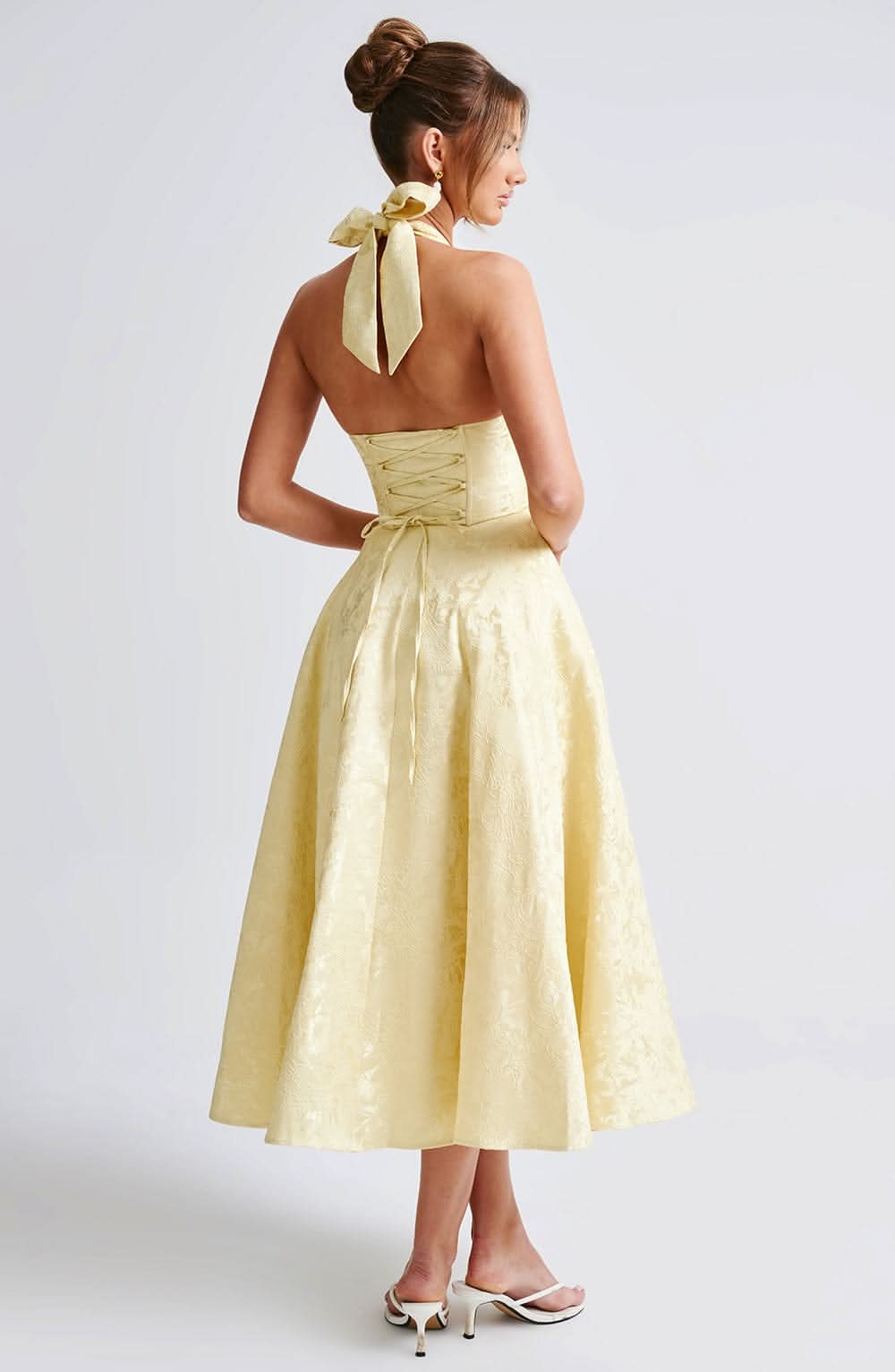 Women's halter midi dress with V-neckline and full A-line skirt in white and pale yellow