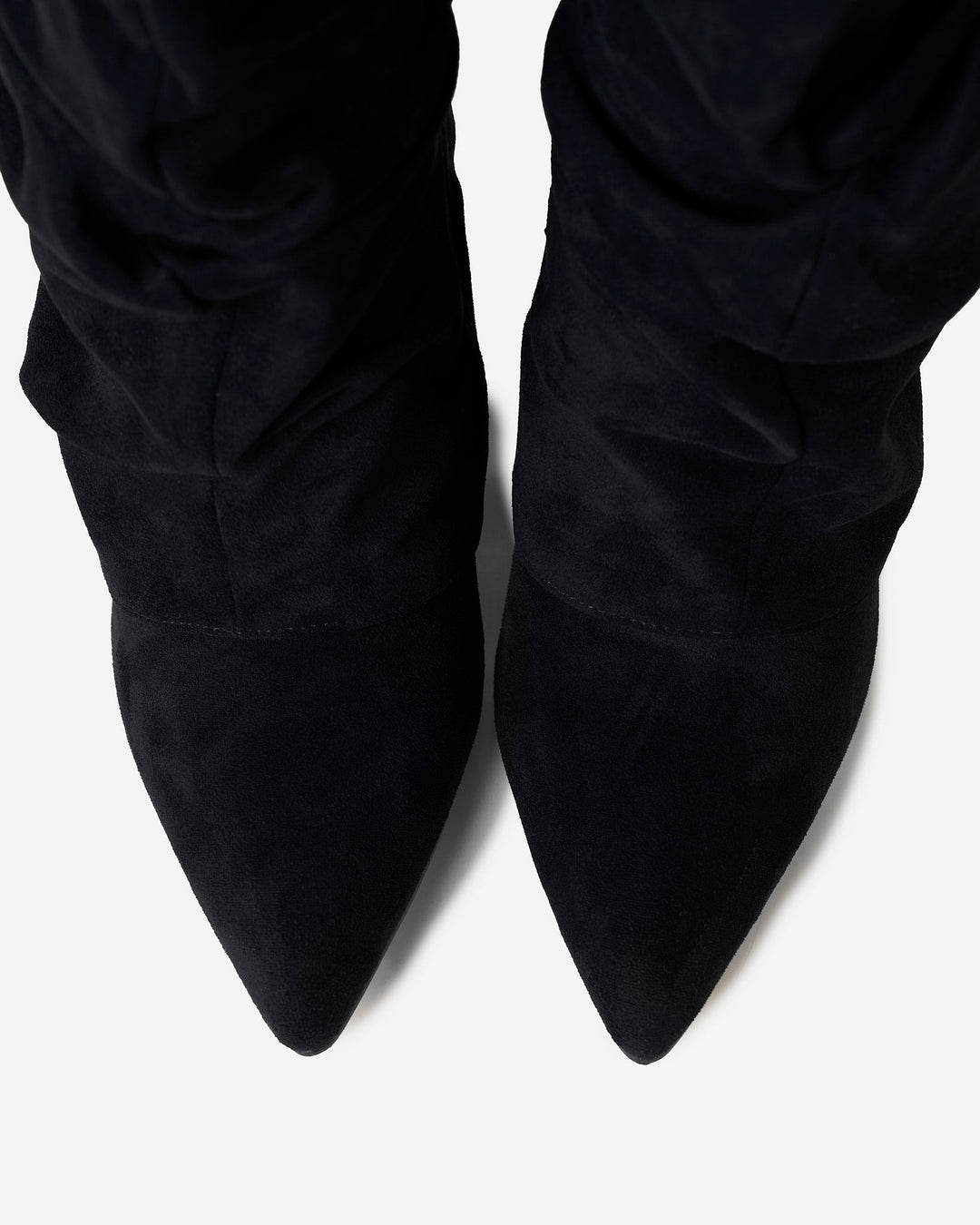 Women's black knee-high slouch boots with pointed toes