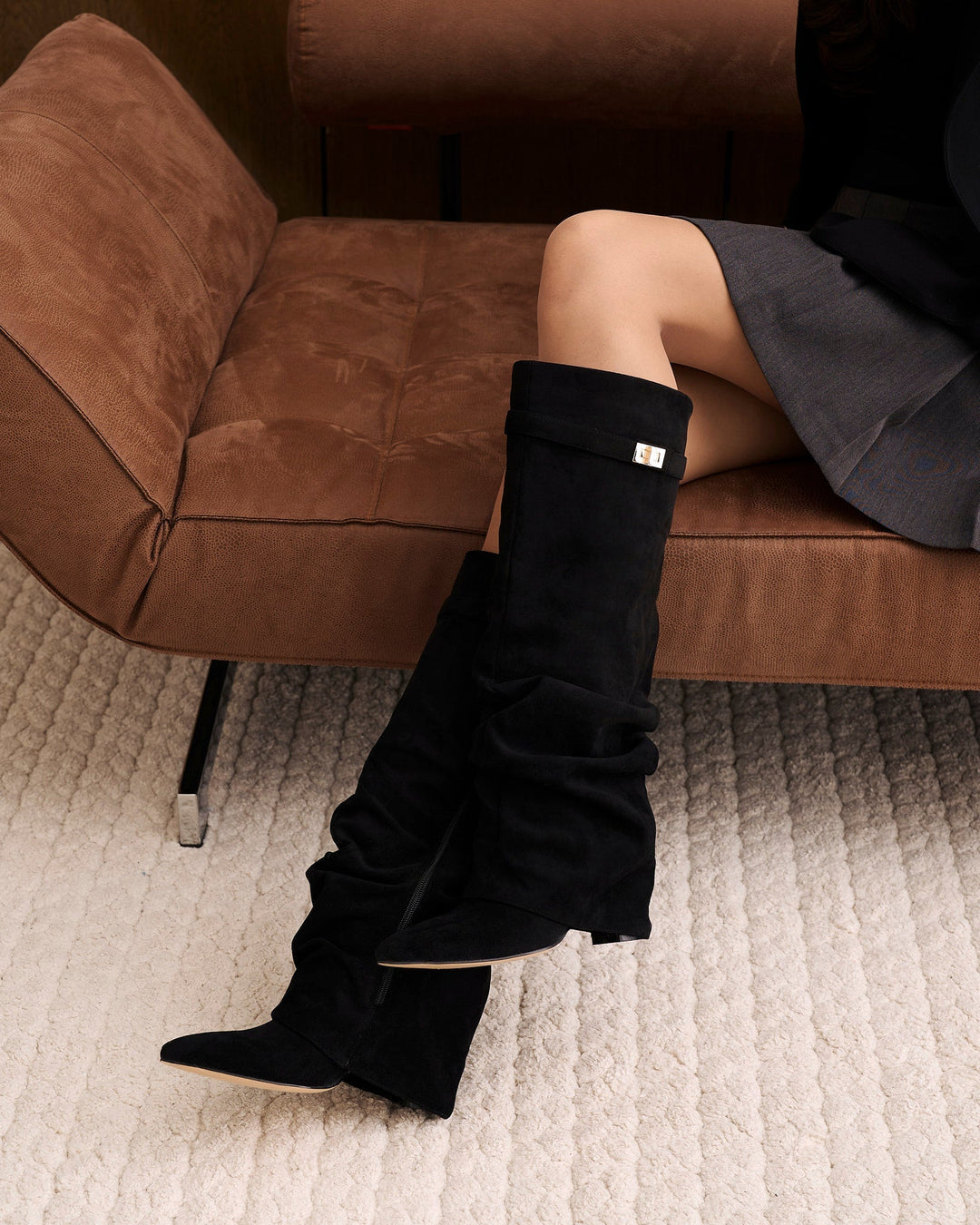Women's black knee-high slouch boots with pointed toes