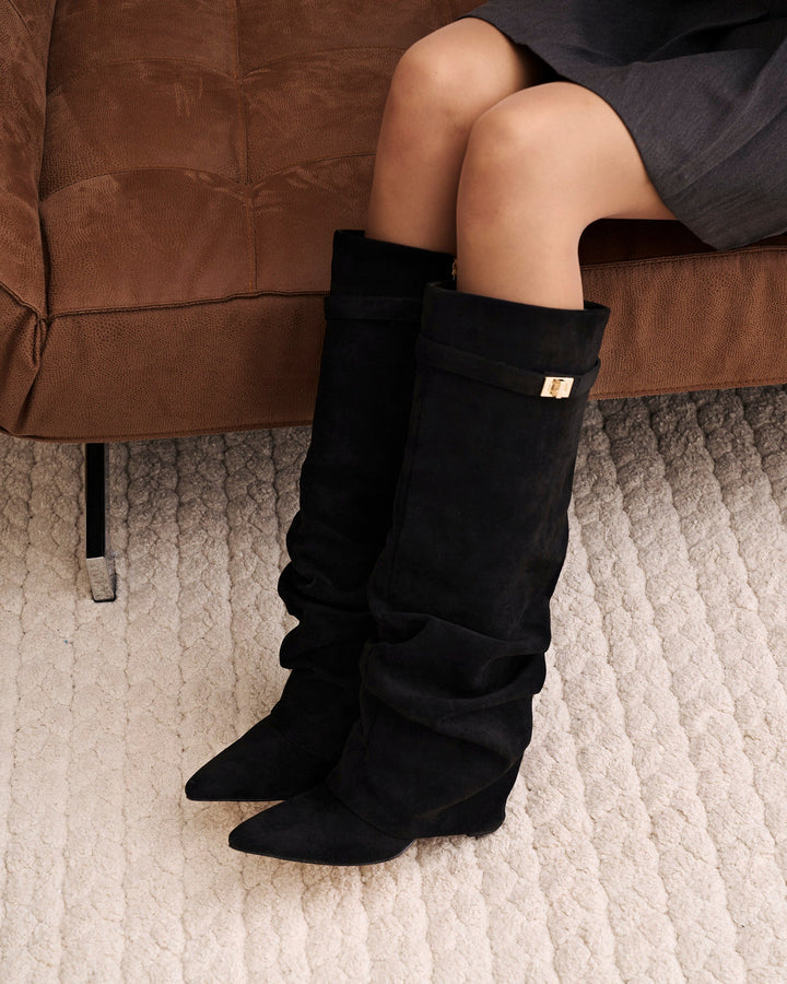 Women's black knee-high slouch boots with pointed toes