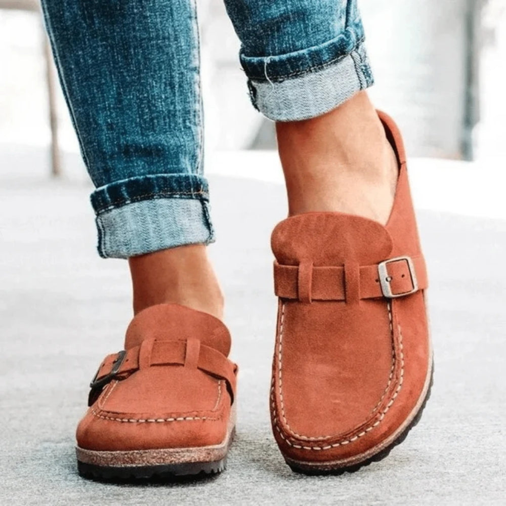Women's moc toe loafers with buckle straps and flat textured soles