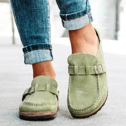 Women's moc toe loafers with buckle straps and flat textured soles