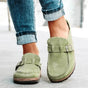 Women's moc toe loafers with buckle straps and flat textured soles