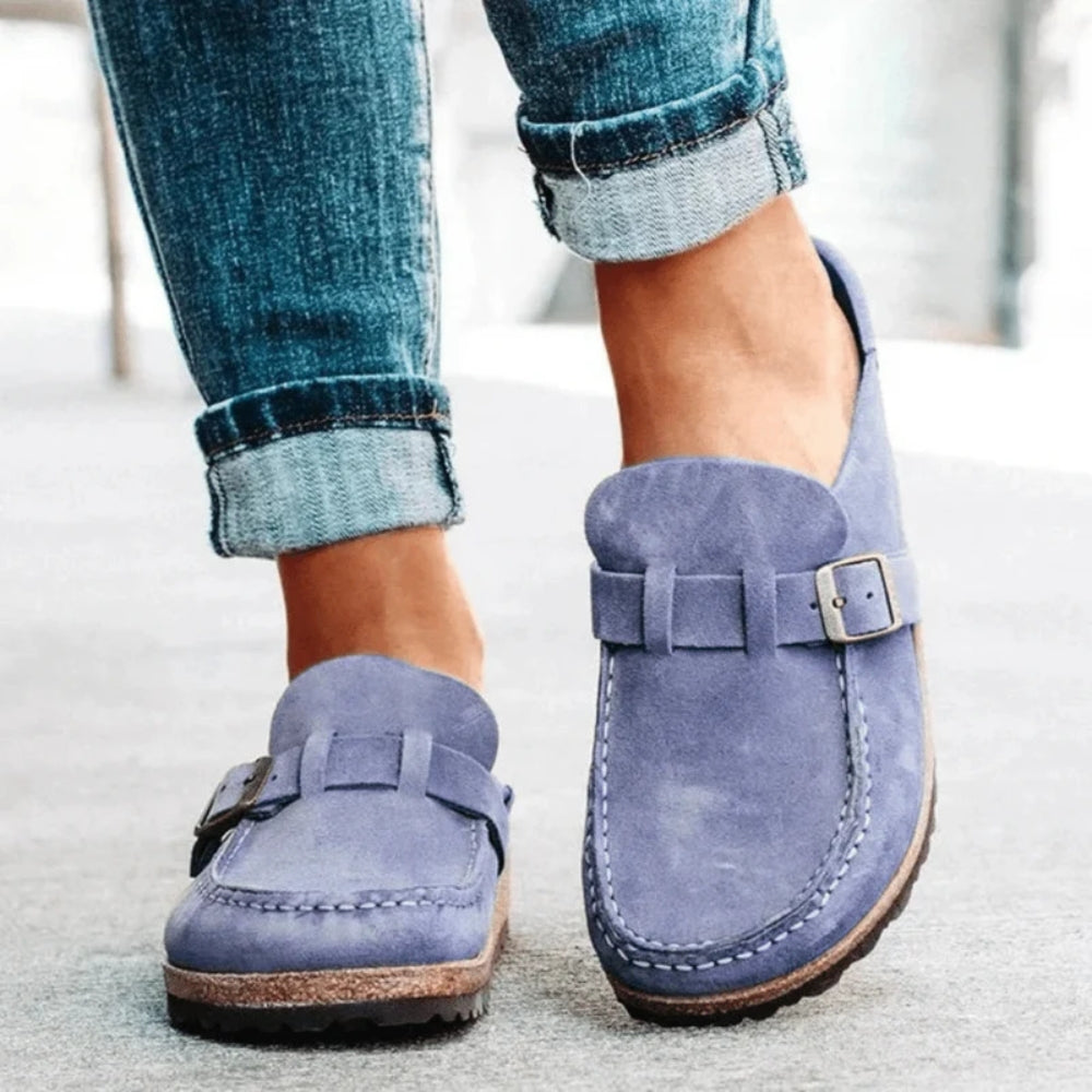 Women's moc toe loafers with buckle straps and flat textured soles