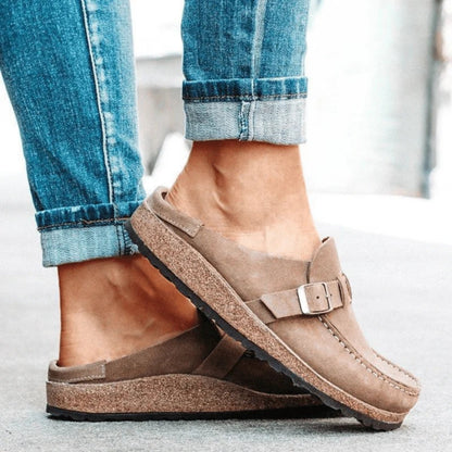 Women's moc toe loafers with buckle straps and flat textured soles