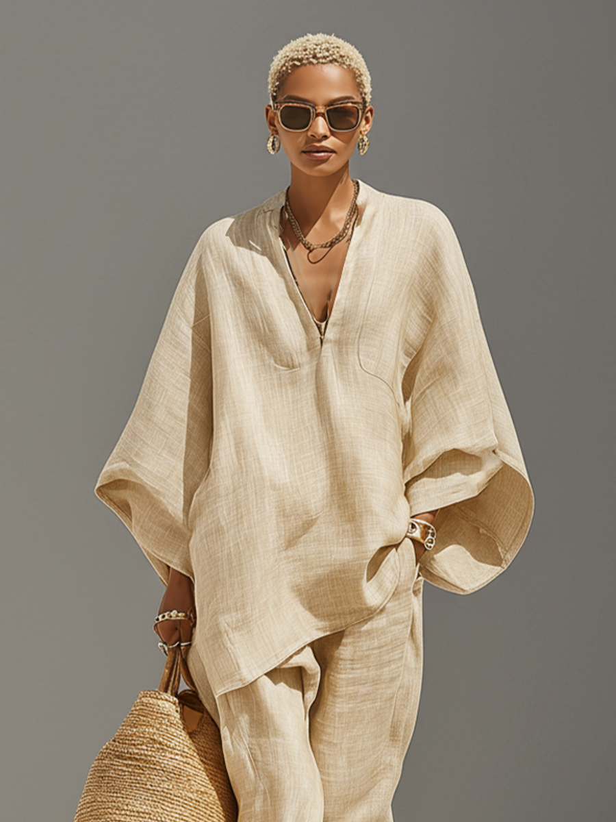 Women's textured beige asymmetric two-piece set with oversized shirt and tapered trousers