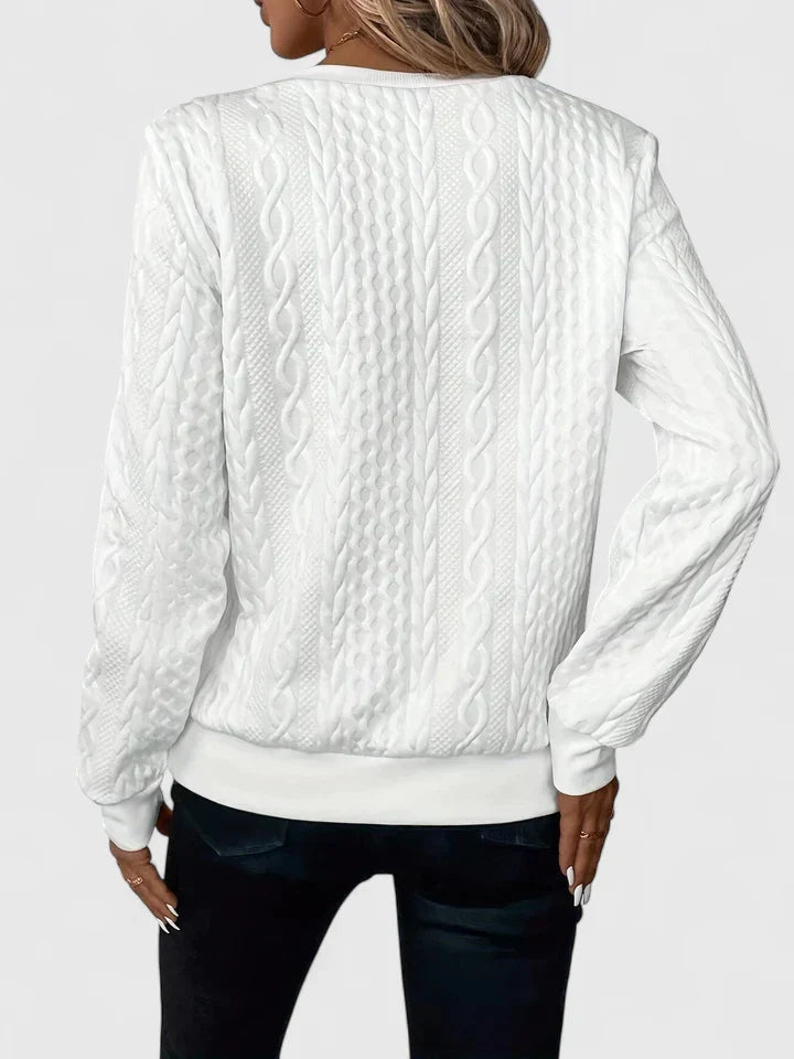 Women's textured cable knit sweater with zip neckline and ribbed trims