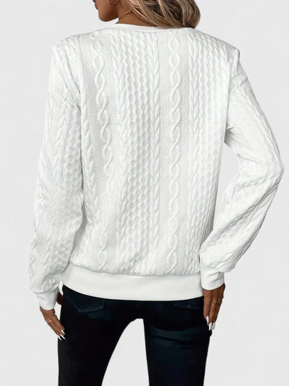 Women's textured cable knit sweater with zip neckline and ribbed trims