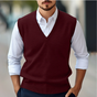 Men's sleeveless V-neck sweater vest layered over a white collared shirt