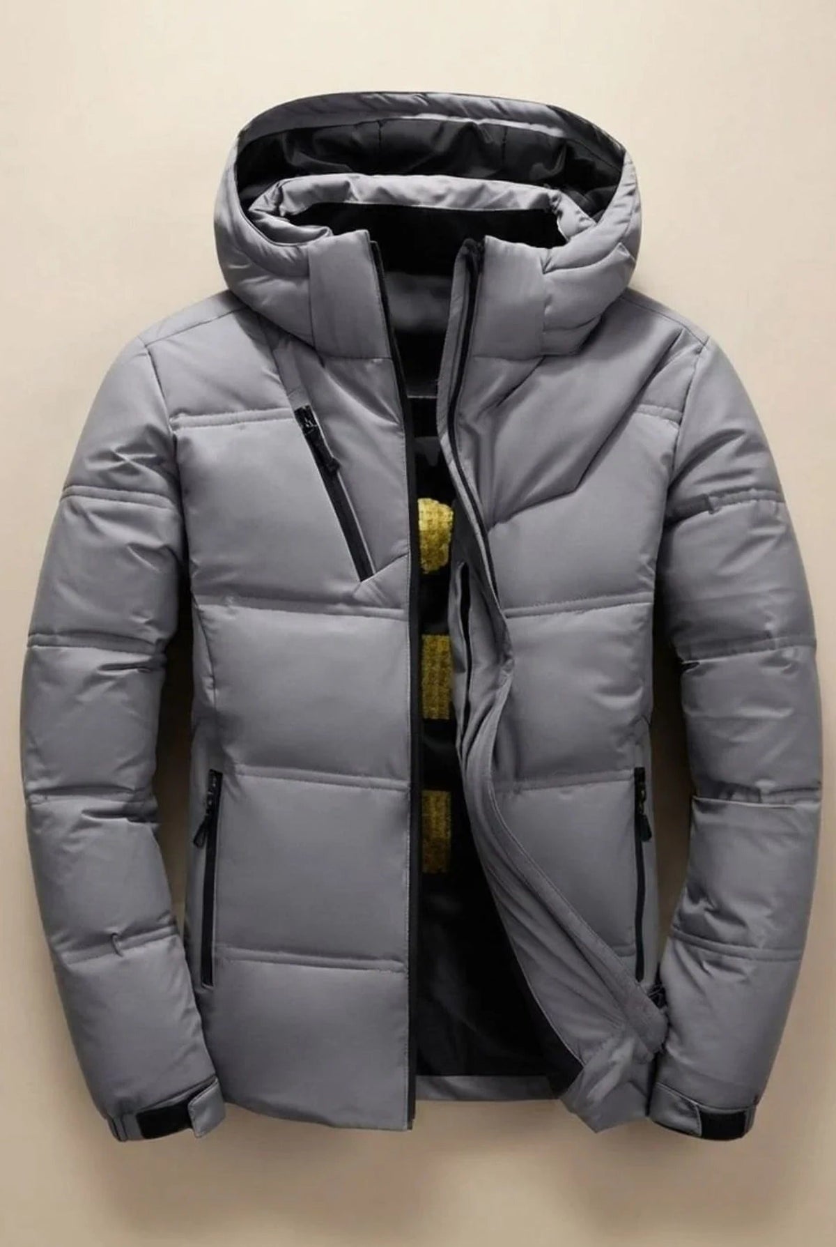Men's hooded padded jacket with quilted panels and zip pockets