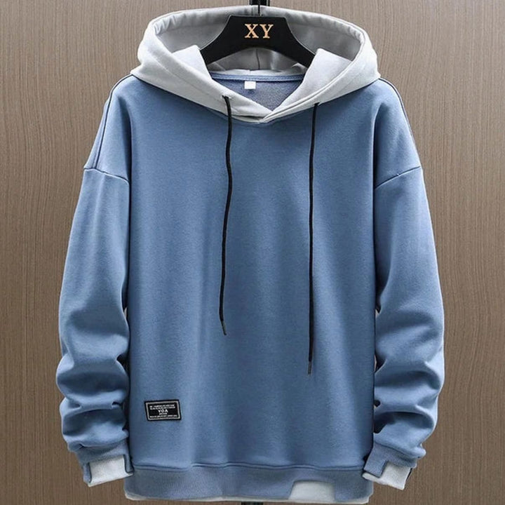 Men's two-tone color-block pullover hoodie with drawstring hood and long sleeves