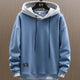 Men's two-tone color-block pullover hoodie with drawstring hood and long sleeves