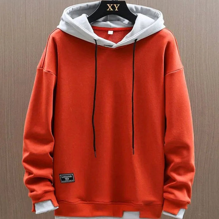 Men's two-tone color-block pullover hoodie with drawstring hood and long sleeves