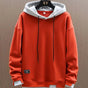 Men's two-tone color-block pullover hoodie with drawstring hood and long sleeves