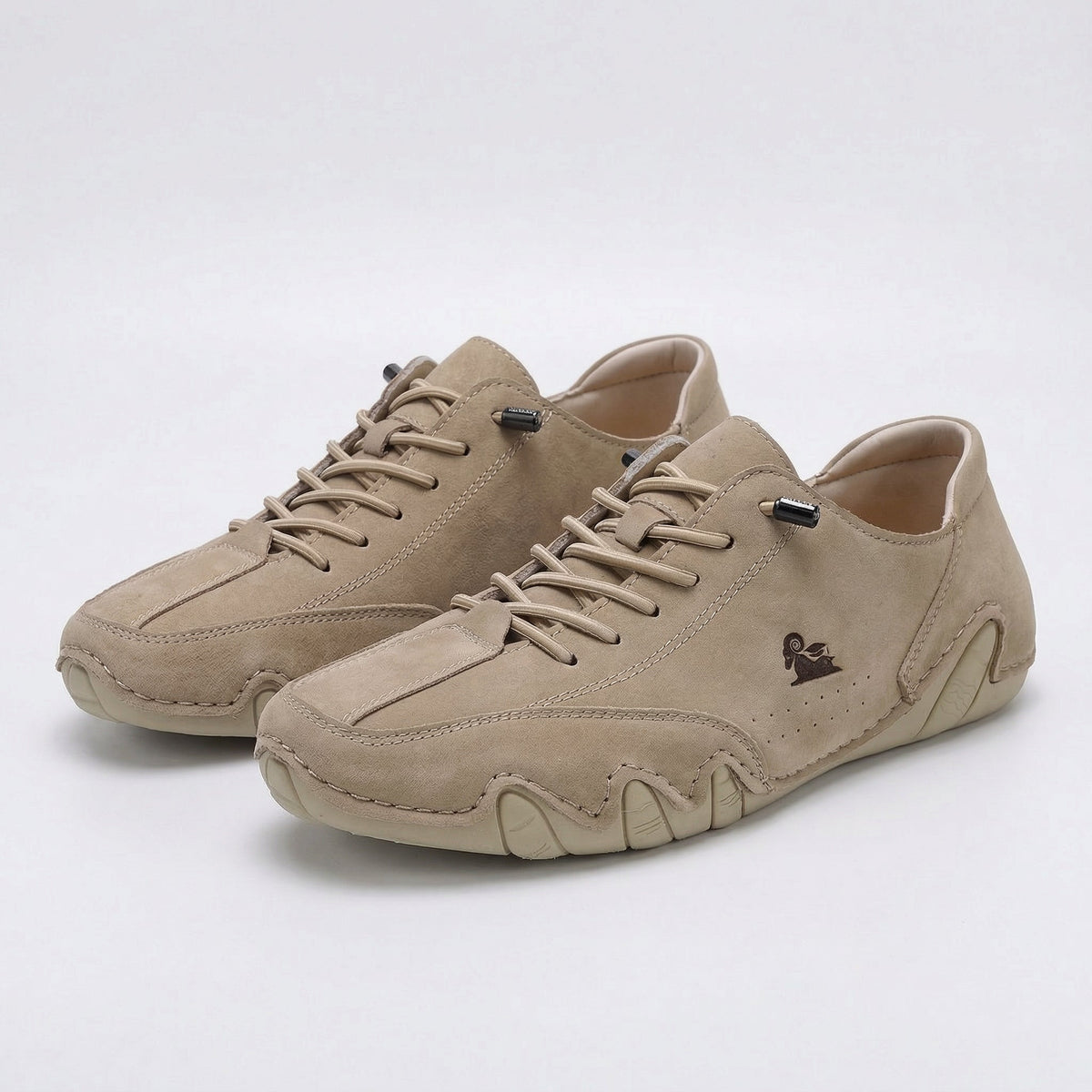 Low-top lace-up sneakers with round toes, stitched panels and segmented soles