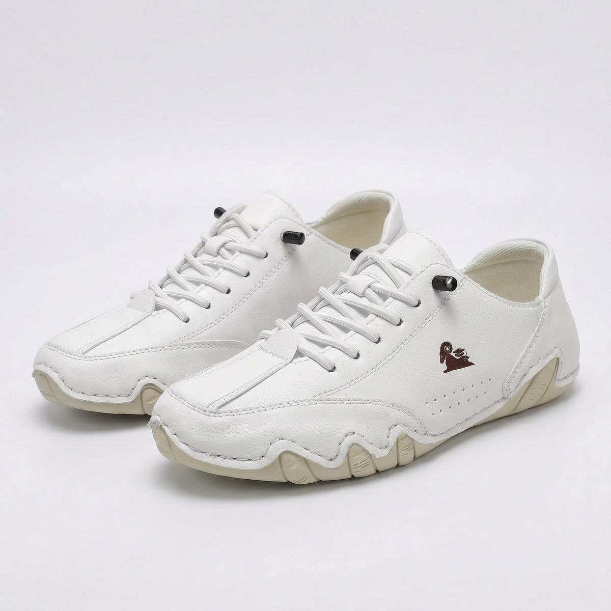 Low-top lace-up sneakers with round toes, stitched panels and segmented soles