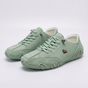 Low-top lace-up sneakers with round toes, stitched panels and segmented soles