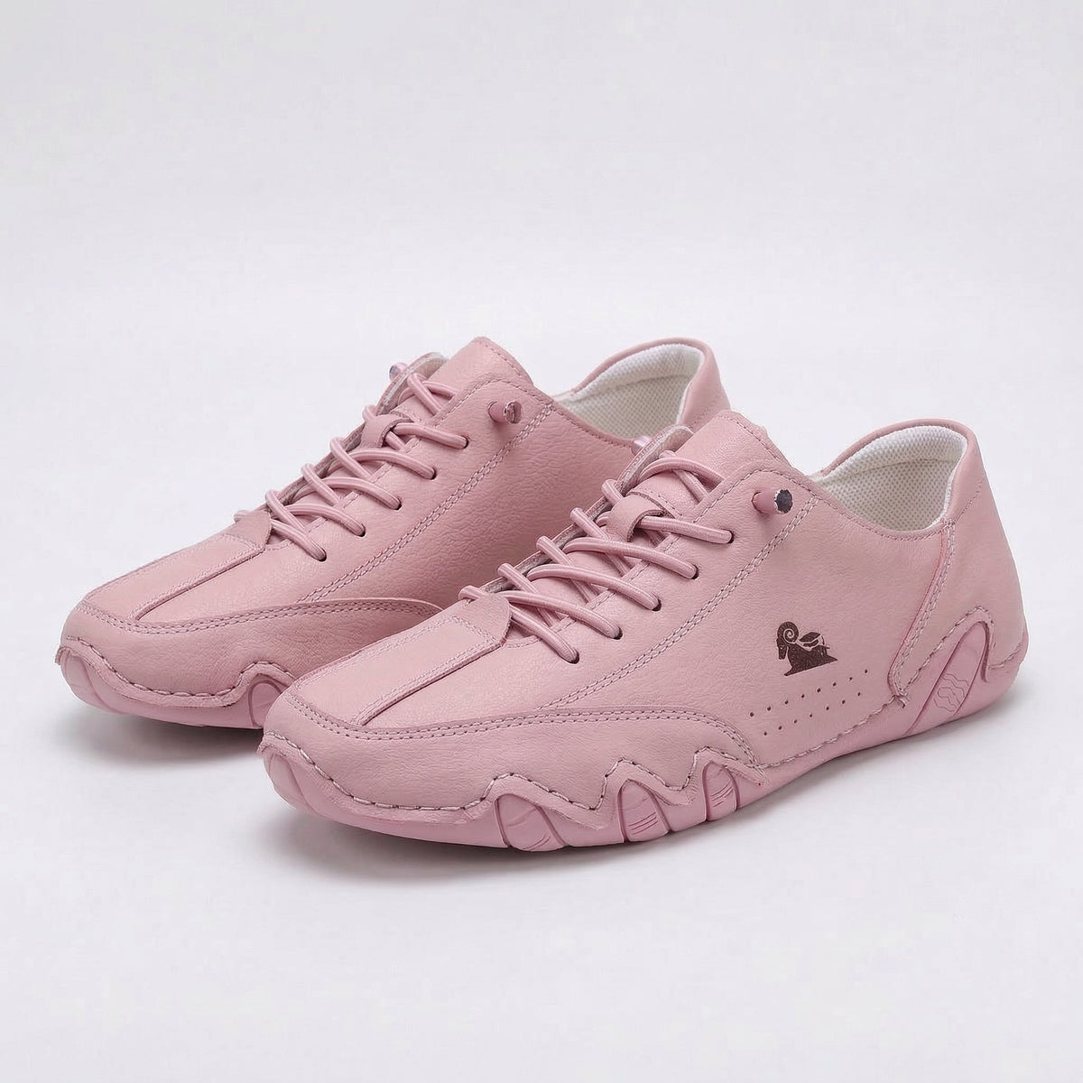 Low-top lace-up sneakers with round toes, stitched panels and segmented soles