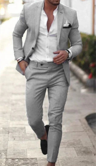 Men's textured two piece suit with notched lapel blazer and tapered trousers