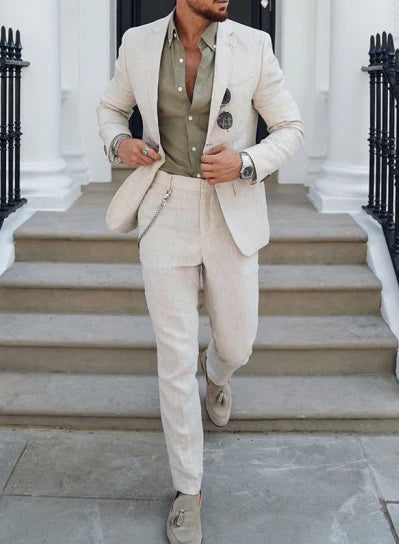 Men's textured two piece suit with notched lapel blazer and tapered trousers